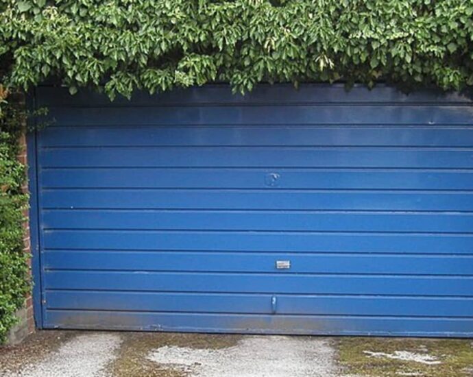 How do I reprogram my garage door open?