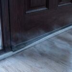 Cold air entering through residential entry door during winter