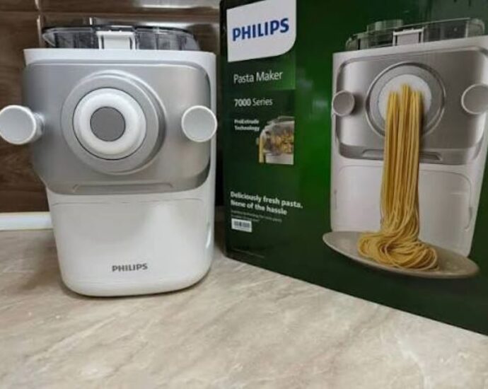 Close-up of pasta strands being extruded from Philips 7000 Series machine