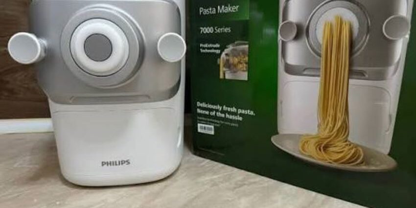 Close-up of pasta strands being extruded from Philips 7000 Series machine