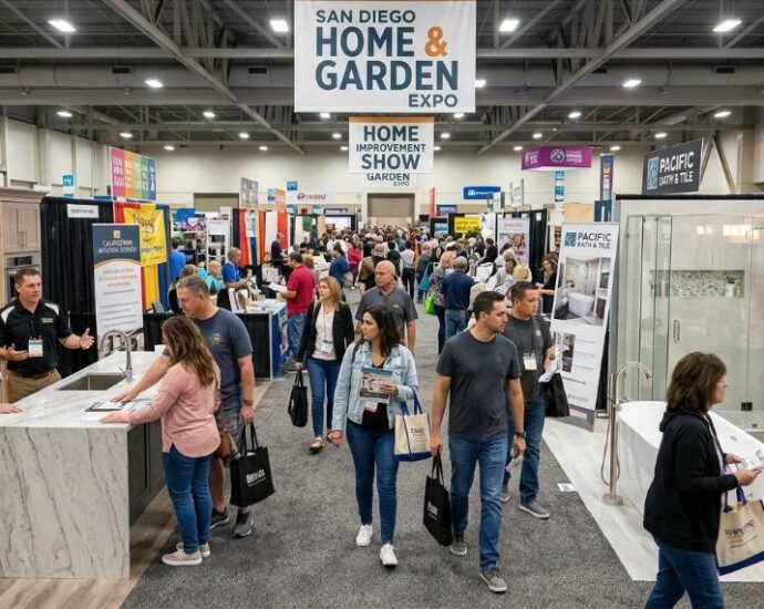 Visitors browsing kitchen and bathroom displays at a home improvement expo in San Diego