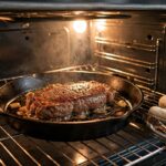 Strip steak in a cast iron skillet inside a home oven